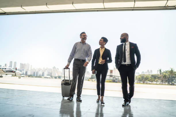 istock Colleagues walking in airplane hangar 1167626114