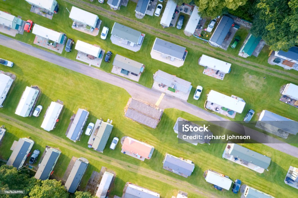 Caravan site park aerial view illuminated by summer sun Caravan site park aerial view illuminated by summer sun uk Manufactured Housing Stock Photo