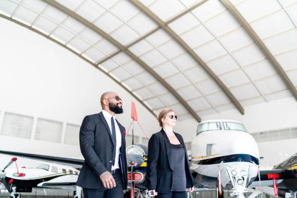 istock Colleagues walking in airplane hangar 1167627008