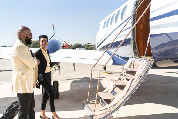 istock Colleagues boarding into flight in a corporate jet 1167627082