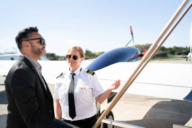 istock Pilot welcoming passenger to board 1167627085