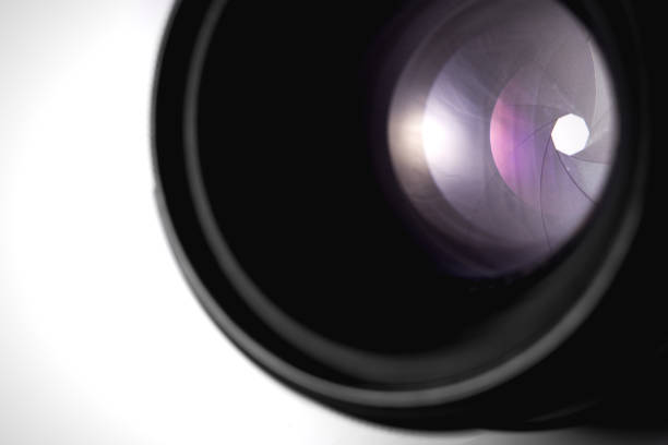 istock closing aperture of camera lens with lense reflections on the white background 1167627109