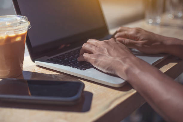 istock Young woman using laptop in a cafe. 1167628598