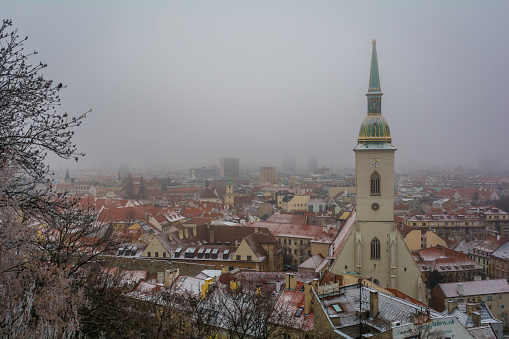 Scenic sight near Bratislava Castle in a snowy winter morning. Slovakia.