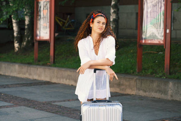 istock Female tourist with suitcase 1167630958
