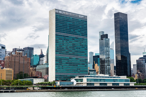 East River, the headquarters of the United Nations (UN) and the Manhattan skyline in New York City, USA