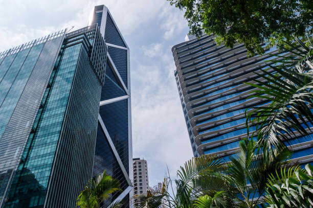 istock Modern blue glass building with reflection. Business centre in Kuala Lumpur 1167633745