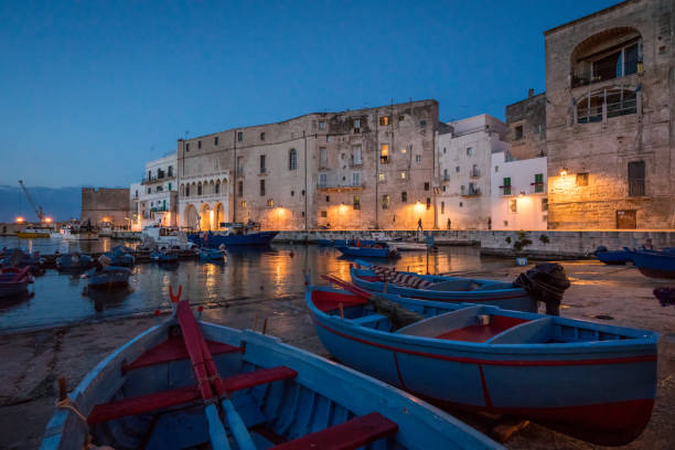 Old harbour in Monopoli at sunset, Bari Province, Puglia (Apulia), southern Italy. Old harbour in Monopoli at sunset, Bari Province, Puglia (Apulia), southern Italy. monopoli puglia stock pictures, royalty-free photos & images
