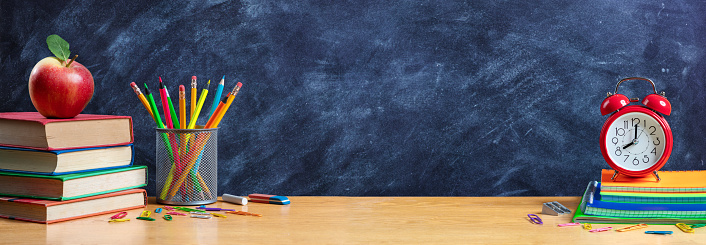 Apple On Stack Books With Pencils And Alarm Clock - Back To School