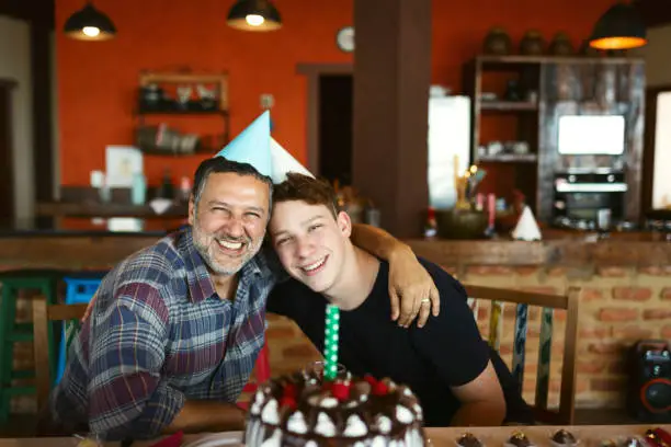Father and son in a birthday party