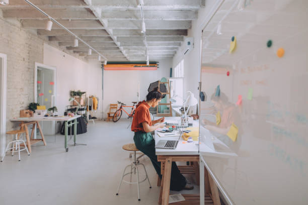 istock Young woman working in a modern office 1167643909