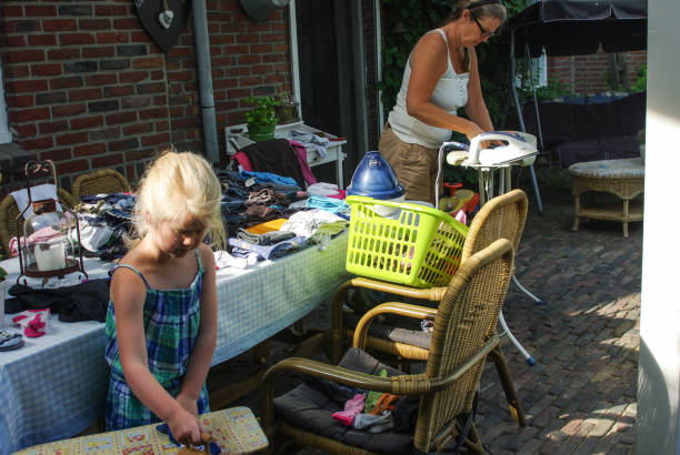 istock Little girl helping ironing 1167644023