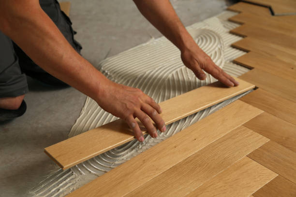 istock Worker laying parquet flooring. Worker installing wooden laminate flooring 1167644130