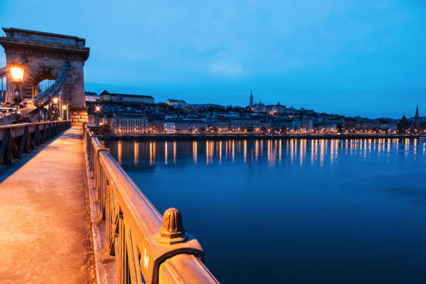 istock Chain bridge and city panorama at dawn 1167646339