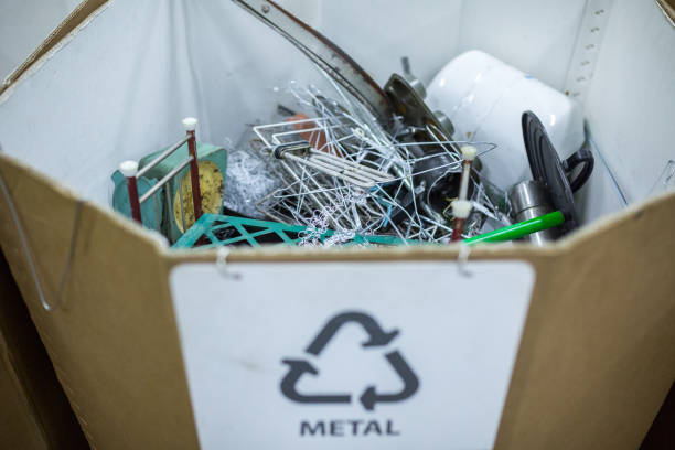 istock Sorting recyclables. The sorted scrap metal, is placed in a container with the appropriate marking. 1167647520