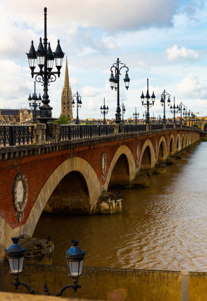 istock Bordeaux river bridge with St Michel cathedral. France 1167649072