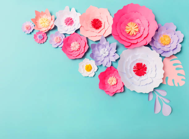 istock Colorful handmade paper flowers background 1167651079