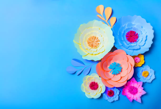 istock Colorful handmade paper flowers background 1167651080