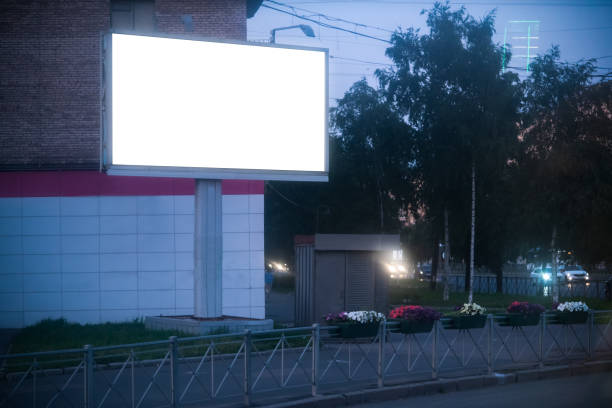 istock advertising billboard glowing in the evening city large 3x6 format 1167651176