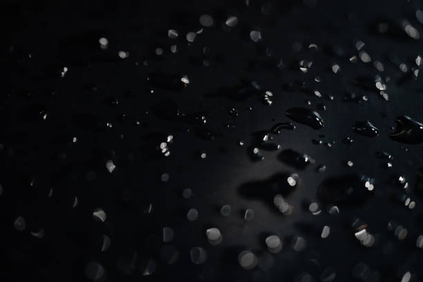 istock abstract drops on hydrophobic surfaces by balls. dark surface out of focus 1167651228