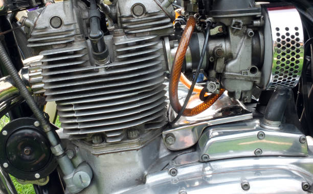 istock close up side view of a large vintage motorcycle engine with cylinders connecting leads and chrome steel parts 1167654317