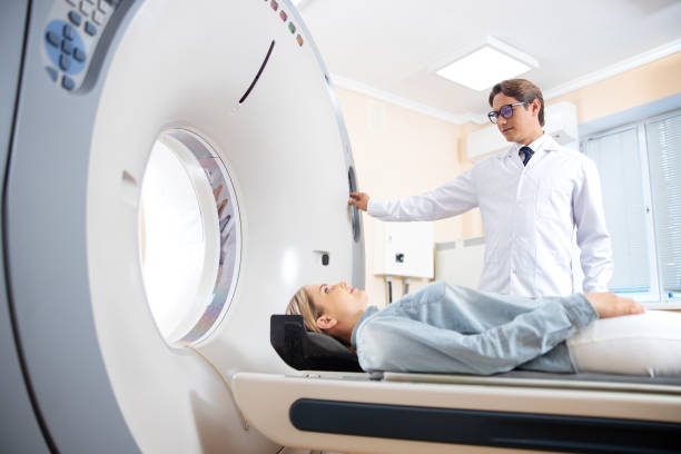 Young woman having CT scan in hospital stock photo