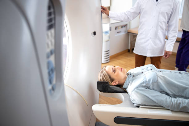 istock Smiling woman having computed tomography test in hospital 1167655696