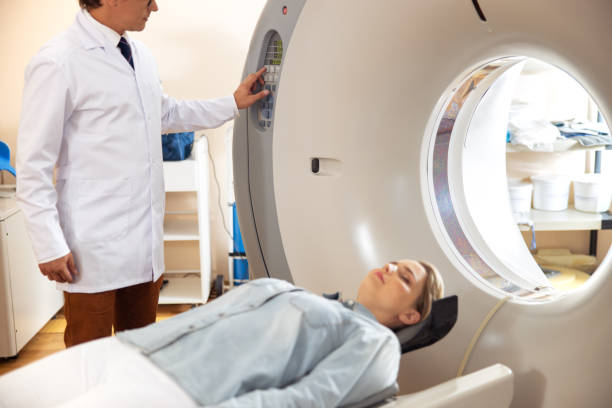 istock Lady lying on CT scanner bed during tomography test in hospital 1167655704