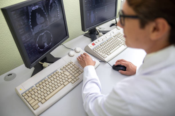istock Doctor using computer to check results of CT scan 1167655777