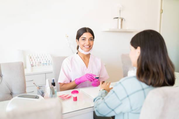 istock Young Cosmetician And Client At Beauty Salon 1167657769