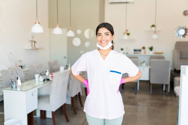 istock Self-Assured Salon Worker Smiling In Uniform 1167657829