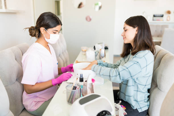 istock Female Technician Providing Services To Woman In Spa 1167659419