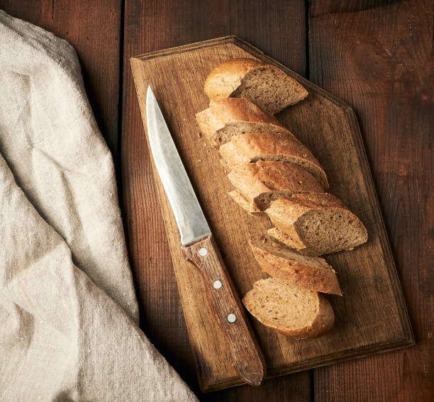 istock sliced rye flour baguette on a wooden cutting board 1167660131