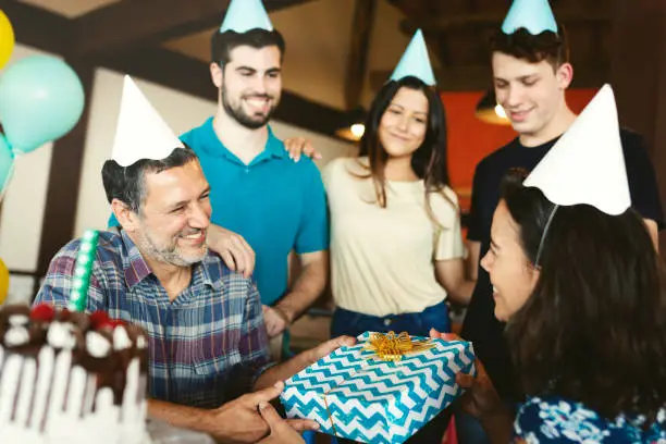 Family together celebrating a birthday party