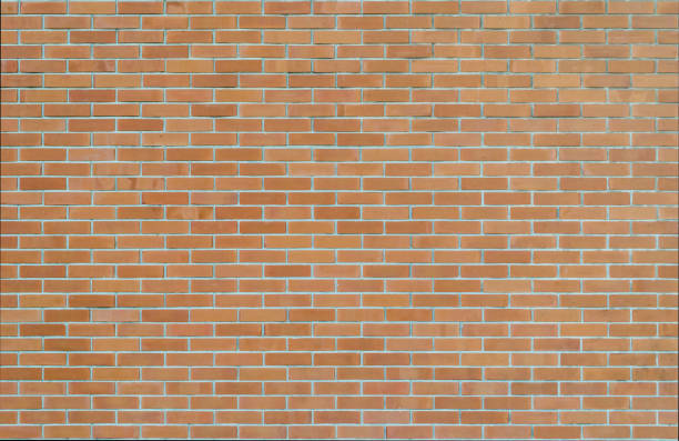 istock Brick wall texture background in orange brown tone 1167663803