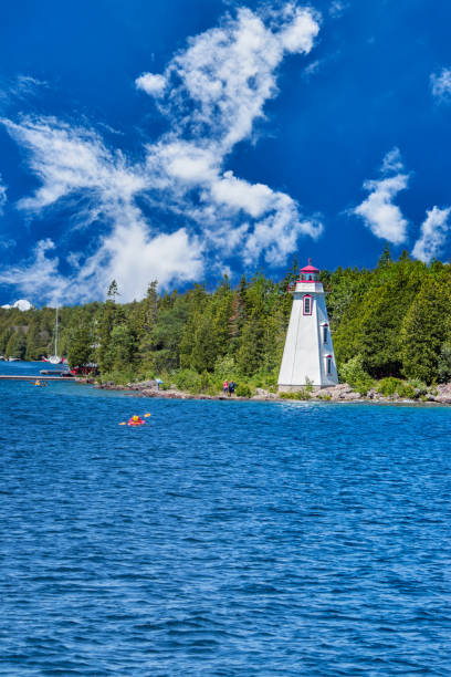 istock Bright afternoon clouds over the lighthouse on Lake Huron 1167663826