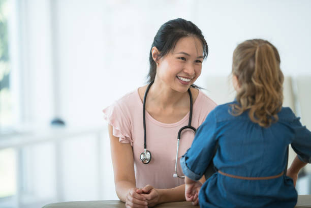 istock Female pediatrician meets with patient 1167663958