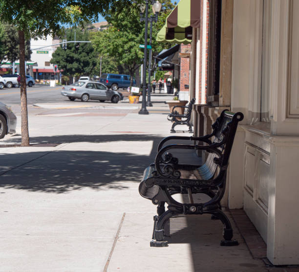 istock Ornate Public Steel Bench in Shade Wide View 1167667528