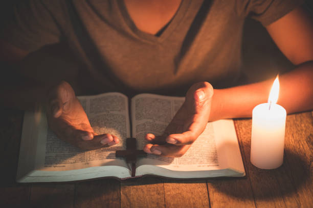 istock A boy is praying seriously and hopefully to Jesus 1167673775