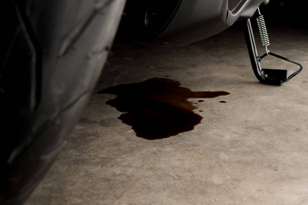 istock dOil leak or drop from engine of motorcycle on concrete floor , check and maintenance 1167681451