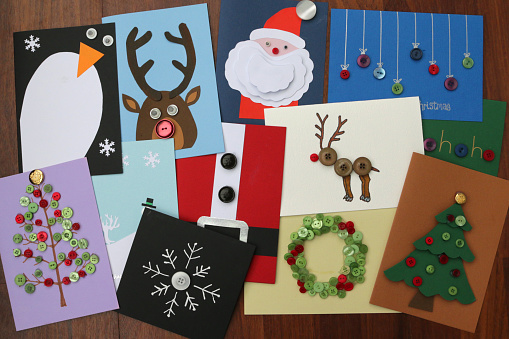 Image of homemade DIY easy Christmas cards designs with cut-outs Santa Claus, snowmen, snowflakes, reindeer, Xmas trees with baubles, wreaths, penguins, buttons and how to make Father Christmas card ideas for happy holidays, handmade Xmas greetings cards