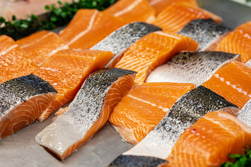 Display Of Fresh Salmon Fillets In Fish Market