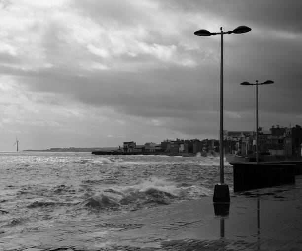 istock Town and coast at high tide 1167697610