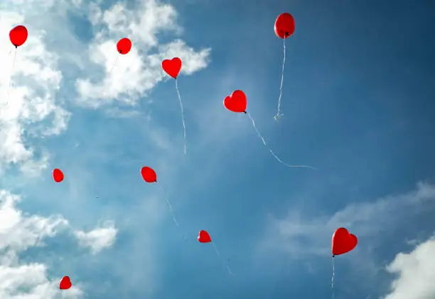 Photo of Red Heart shaped Ballons with sky background