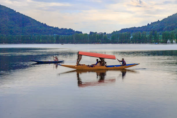 Scenic view of Dal lake, Jammu & Kashmir, India unidentified tourists enjoying boating at Dal Lake, Sri Nagar, Jammu & Kashmir, India on june 22, 2018 lake nagin stock pictures, royalty-free photos & images