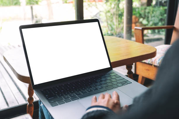 istock a woman using and touching laptop touchpad with blank white desktop screen 1167698732