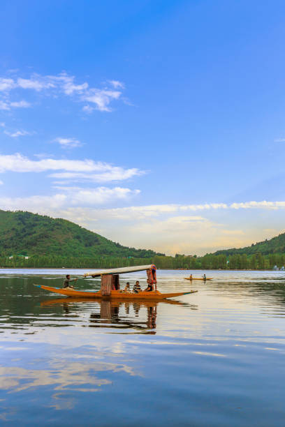 Scenic view of Dal lake, Jammu & Kashmir, India unidentified tourists enjoying boating at Dal Lake, Sri Nagar, Jammu & Kashmir, India on june 22, 2018 lake nagin stock pictures, royalty-free photos & images