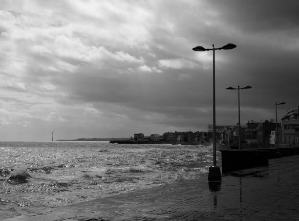 istock Coast at high tide and town 1167700230