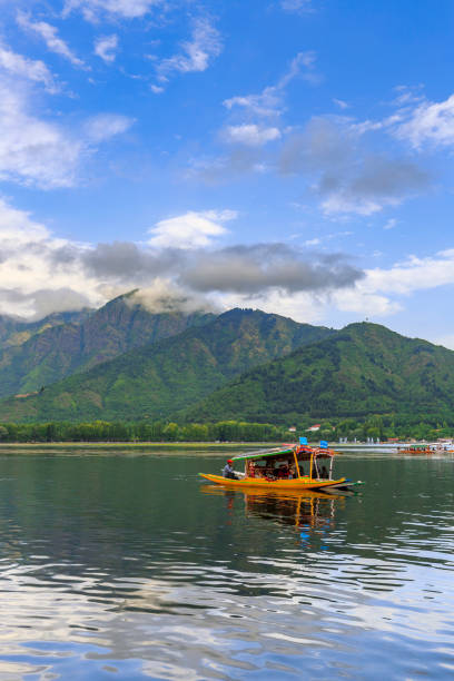 Scenic view of Dal lake, Jammu & Kashmir, India unidentified tourists enjoying boating at Dal Lake, Sri Nagar, Jammu & Kashmir, India on june 22, 2018 lake nagin stock pictures, royalty-free photos & images