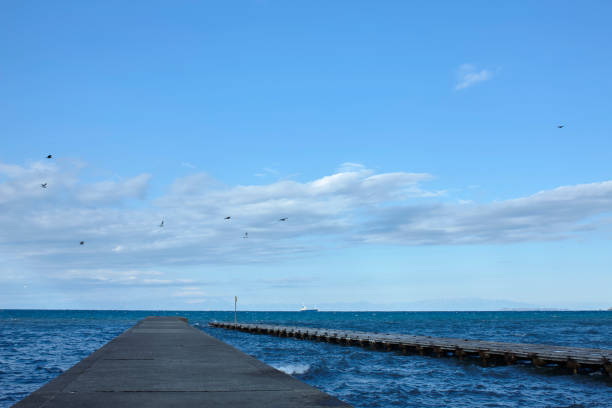 istock Embankment over blue sky and sea 1167700735